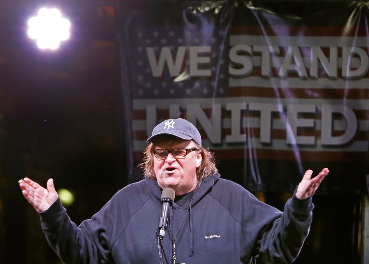 Filmmaker Michael Moore speaks to thousands of people at an anti-Trump rally and protest in front of the Trump International Hotel, Thursday, Jan. 19, 2017, in New York. President-elect Donald Trump, a New Yorker, is scheduled to take the oath of office Friday in Washington. (AP Photo/Kathy Willens) (AP)