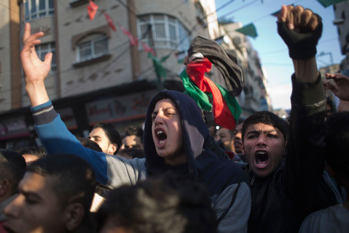 Palestinians chant slogans during a demonstration against the chronic power cuts in Jabaliya refugee camp, northern Gaza Strip, Thursday, Jan. 12, 2017. (AP Photo/ Khalil Hamra) (AP)