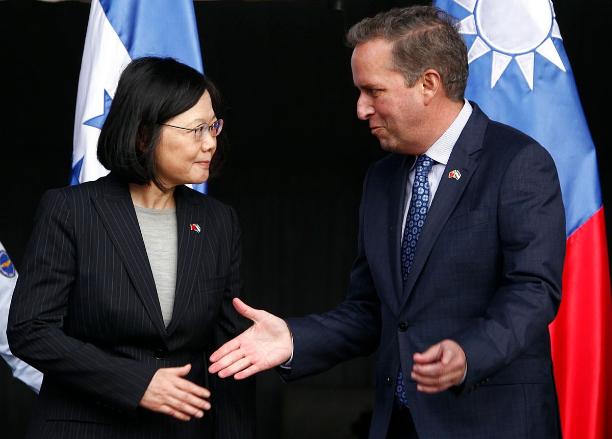 CORRECTS SPELLING OF GUATEMALA - Taiwan's President Tsai Ing-wen, left, shakes hands with First Vice President of Honduras Ricardo Alvarez after arriving at Soto Cano Air Base outside Comayagua, Honduras, Sunday, Jan. 8, 2017. The Taiwanese leader will meet with Honduran President Juan Orlando Hernandez on Monday, as part of a weeklong state tour to reinforce Taiwanese relations with Honduras, Guatemala, El Salvador, and Nicaragua. (AP Photo/Fernando Antonio) (AP)