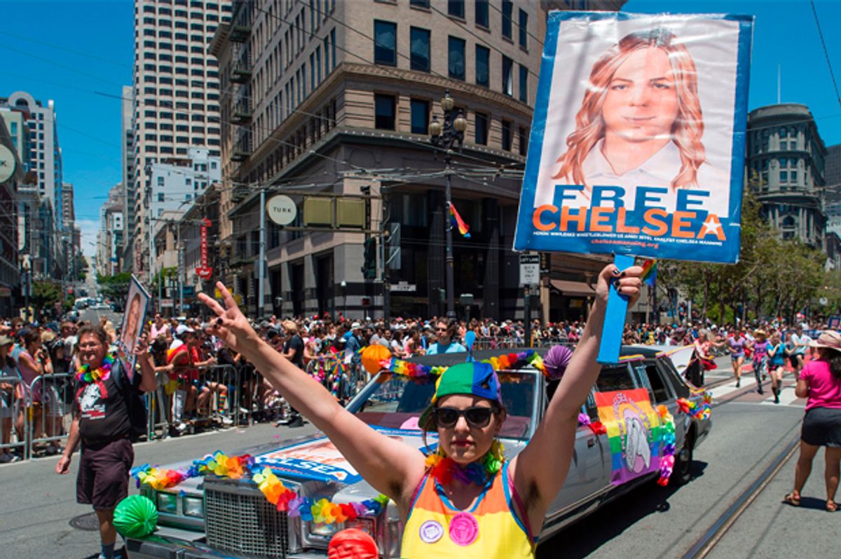 Protester holds up a sign advocating the release of WikiLeaks whistle blower Chelsea Manning along the Gay Pride parade route in San Francisco   (Getty/Josh Edelson)
