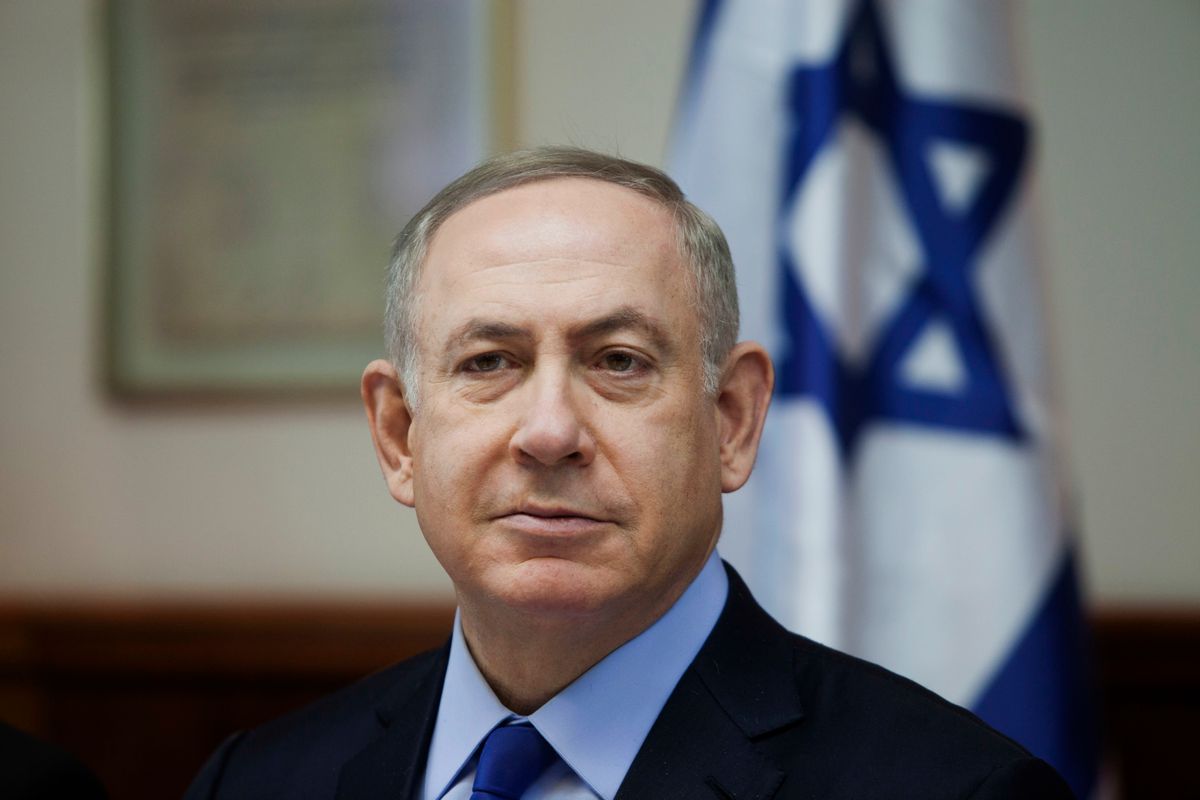 FILE -- In this Sunday, Dec. 25, 2016 file photo, Israeli Prime Minister Benjamin Netanyahu attends a weekly cabinet meeting in Jerusalem. On Wednesday, Jan. 5, 2017, Netanyahu called for a pardon for a soldier convicted of manslaughter in the shooting death of a badly wounded Palestinian assailant. With his comment, the prime minister has plunged into a raging political debate that has divided the country and put himself at odds with the military. Sgt. Elor Azaria was convicted on Wednesday of manslaughter in the fatal shooting of a Palestinian who lay on the ground incapacitated from shots sustained after he stabbed and wounded a soldier in the volatile West Bank city of Hebron. (Dan Balilty/Pool photo via AP, File) (Dan Balilty/Pool photo via AP, File)