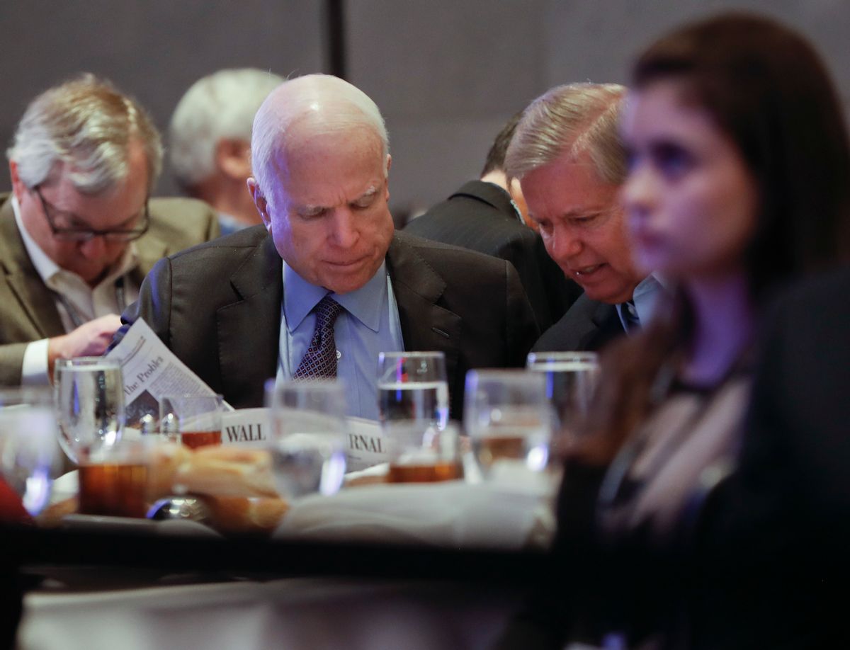 In this Jan. 26, 2017, photo, Sen. John McCain, R-Ariz., left, and Sen. Lindsey Graham, R-S.C., right, read the Wall Street Journal newspaper as they wait for President Donald Trump to speak at the House and Senate GOP lawmakers at the annual policy retreat in Philadelphia. McCain has emerged as Trump’s top Republican nemesis on Capitol Hill. Since Trump’s inauguration, McCain has broken with the president on his immigration order, warned him against any rapprochement with Moscow and lectured him on the illegality of torture. He supplied only a tepid endorsement of Rex Tillerson, Trump’s secretary of state nominee. (AP Photo/Pablo Martinez Monsivais) (AP)
