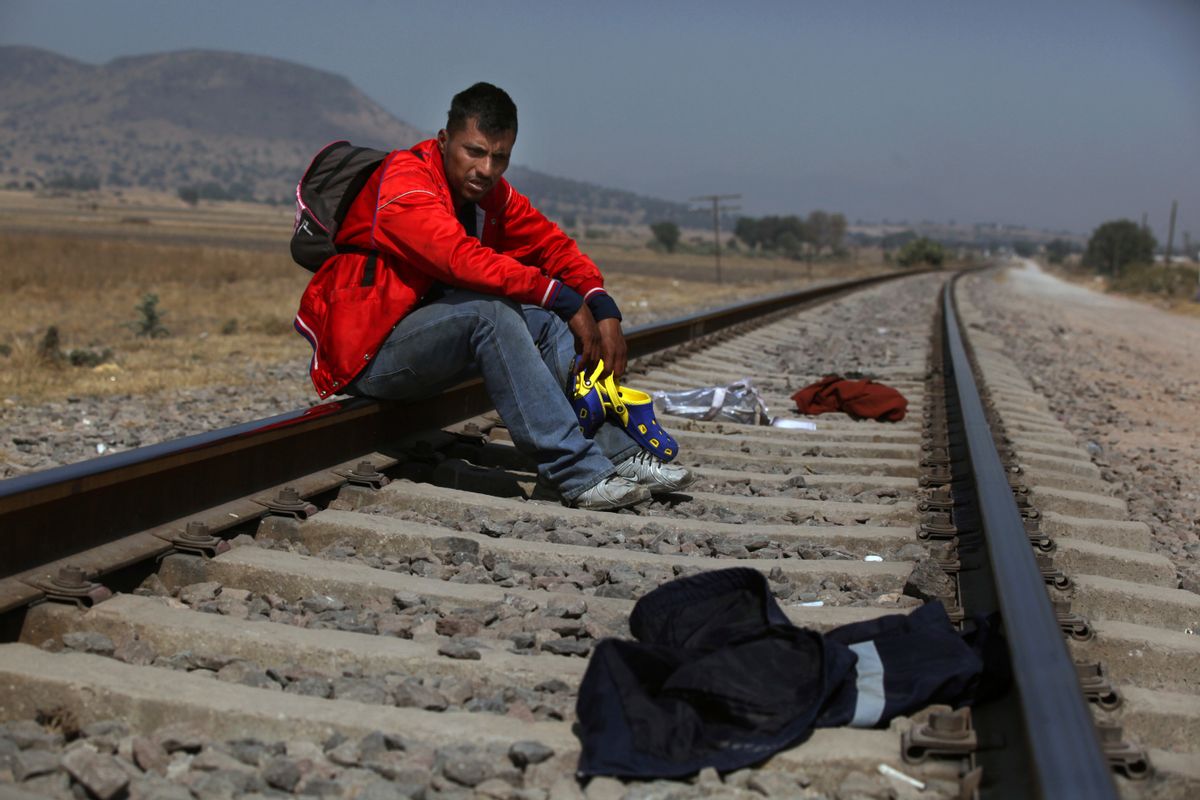Mario Vazquez Santiago, a migrant from Guatemala, waits for a northbound train on the outskirts of Mexico City, Wednesday, Jan. 25, 2017. President Donald Trump signed two executive orders on Wednesday to jumpstart construction of a U.S.-Mexico border wall and strip funding for so-called sanctuary cities, which don't arrest or detain immigrants living in the U.S. illegally. (AP Photo/Marco Ugarte) (AP)