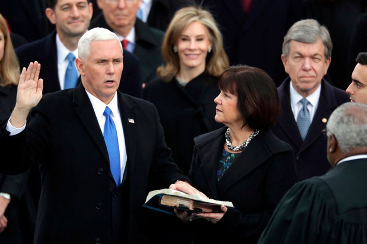 U.S. Vice President Mike Pence (L) takes the oath of office from Supreme Court Justice Clarence Thomas (R)    (Getty/Chip Somodevilla)