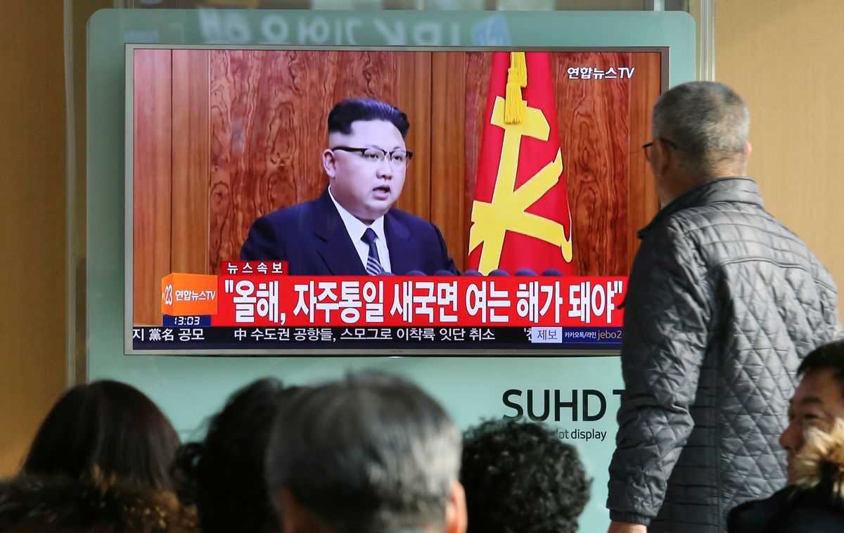 South Koreans watch a TV news program showing North Korean leader Kim Jong Un's New Year's speech, at the Seoul Railway Station in Seoul, South Korea, Sunday, Jan. 1, 2017. North Korea's development of banned long-range missiles is in "final stages," the country's leader Kim was quoted as saying in his New Year's message. The letters read "New Year for Reunification." (AP Photo/Ahn Young-joon) (AP)
