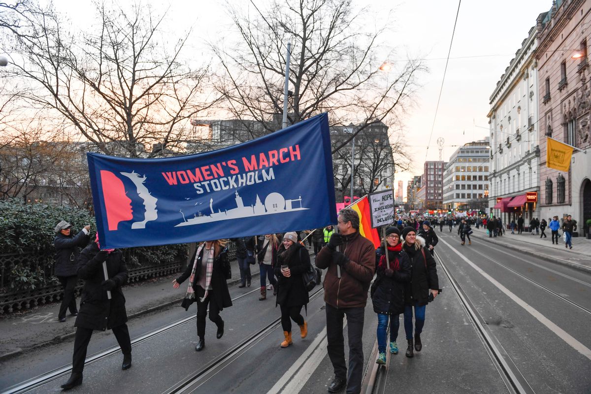 Protesters carrying banners and placards take part in a Women's March in Stockholm, Sweden, Saturday, Jan. 21, 2017. The march is part of a worldwide day of action following the inauguration of US president Donald Trump. () (Pontus Lundahl/TT News Agency via AP)