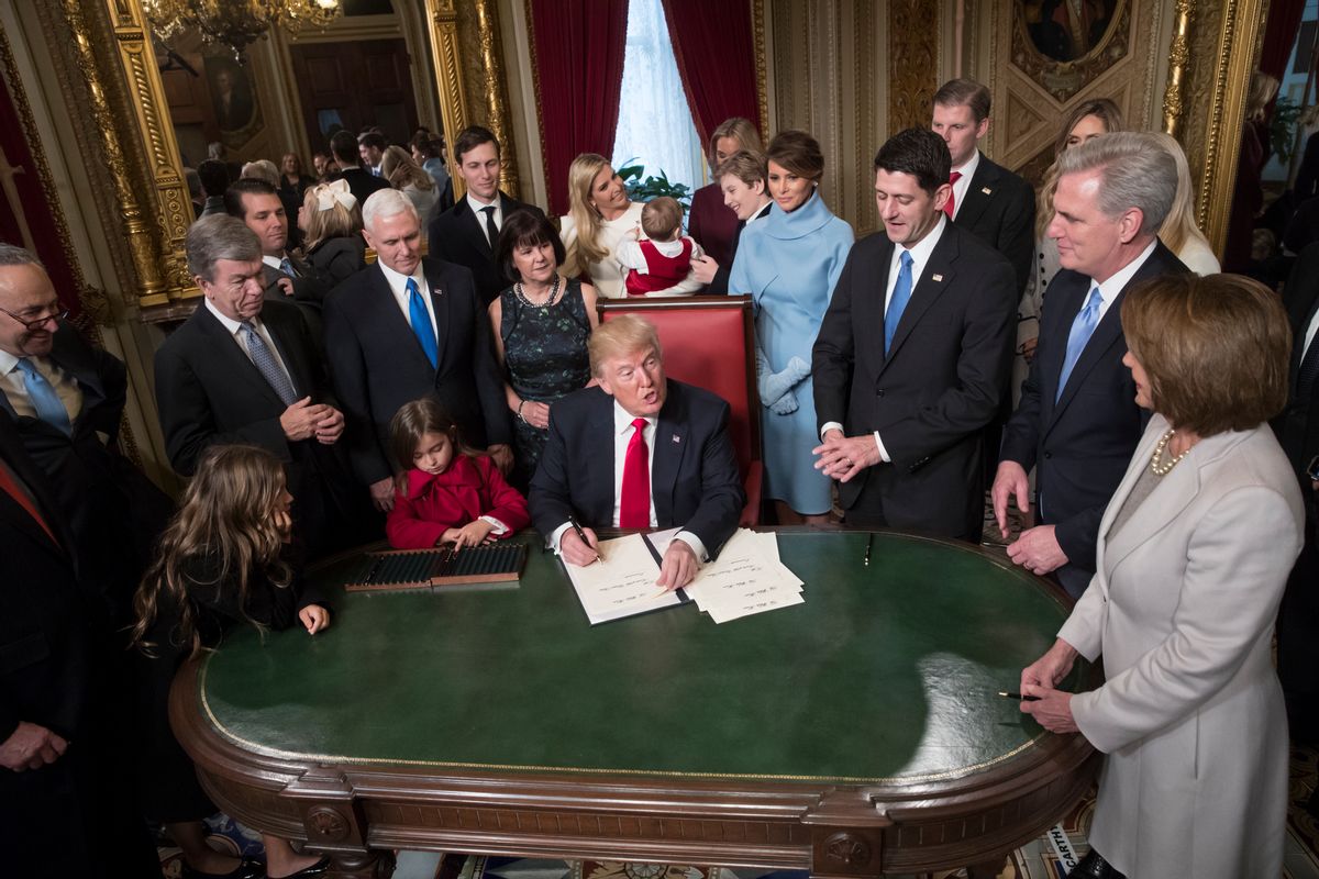 President Donald Trump is joined by the Congressional leadership and his family as he formally signs his cabinet nominations into law, in the President's Room of the Senate, at the Capitol in Washington, Friday, Jan. 20, 2017. From left are Senate Minority Leader Chuck Schumer, D-N.Y., Sen. Roy Blunt, R-Mo., Donald Trump Jr., Vice President Mike Pence, Jared Kushner, Karen Pence, Ivanka Trump, Barron Trump, Melania Trump, Speaker of the House Paul Ryan, R-Wis., Majority Leader Kevin McCarthy, D-Calif., House Minority Leader Nancy Pelosi, D-Calif. (AP Photo/J. Scott Applewhite, Pool) (AP)