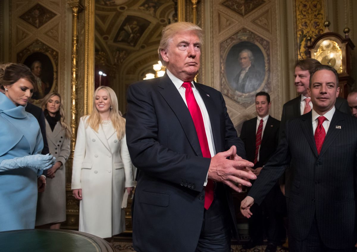President Donald Trump leaves the President's Room of the Senate at the Capitol after he formally signed his cabinet nominations into law, in Washington, Friday, Jan. 20, 2017. He is joined by his wife Melania Trump and and daughter Tiffany Trump. At far right is Chief of Staff Reince Priebus, with White House counsel Donald McGahn, second from right. (AP Photo/J. Scott Applewhite, Pool) (AP)