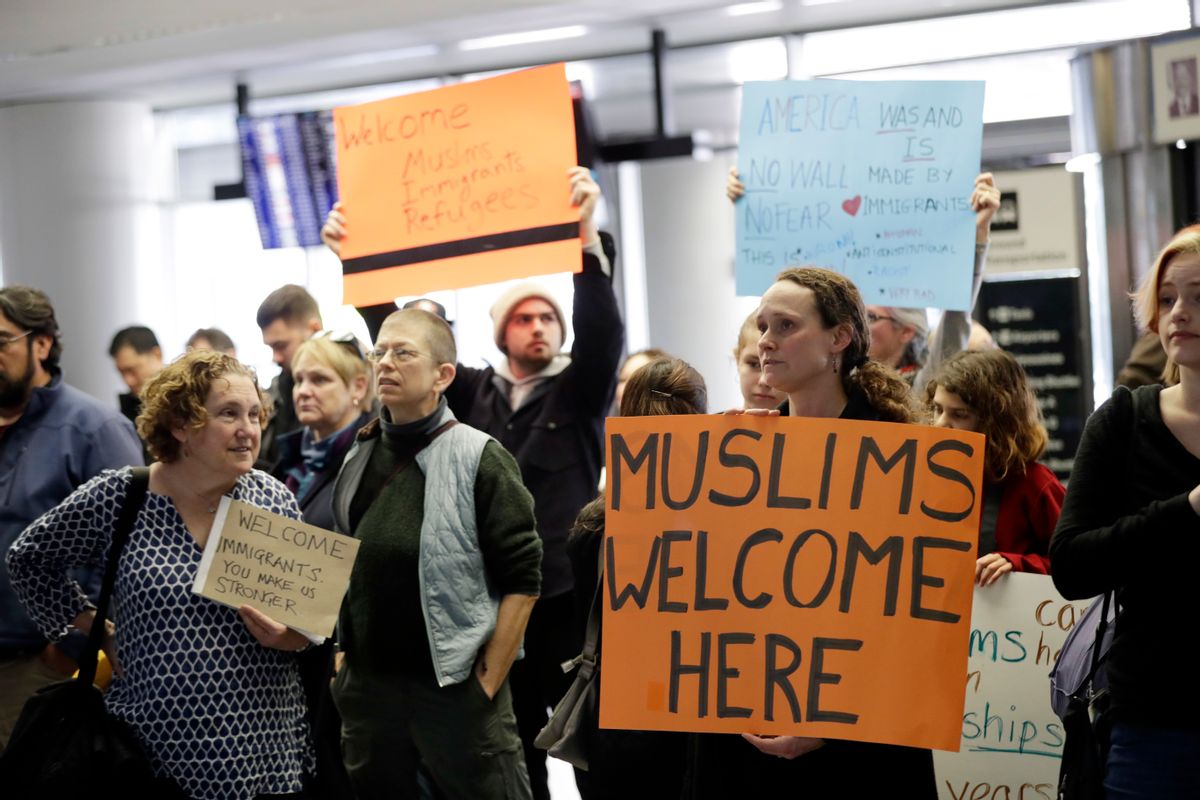 Protesters holds signs at San Francisco International Airport to denounce President Donald Trump's executive order that bars citizens of seven predominantly Muslim-majority countries from entering the U.S., Monday, Jan. 30, 2017, in San Francisco. () (AP Photo/Marcio Jose Sanchez)