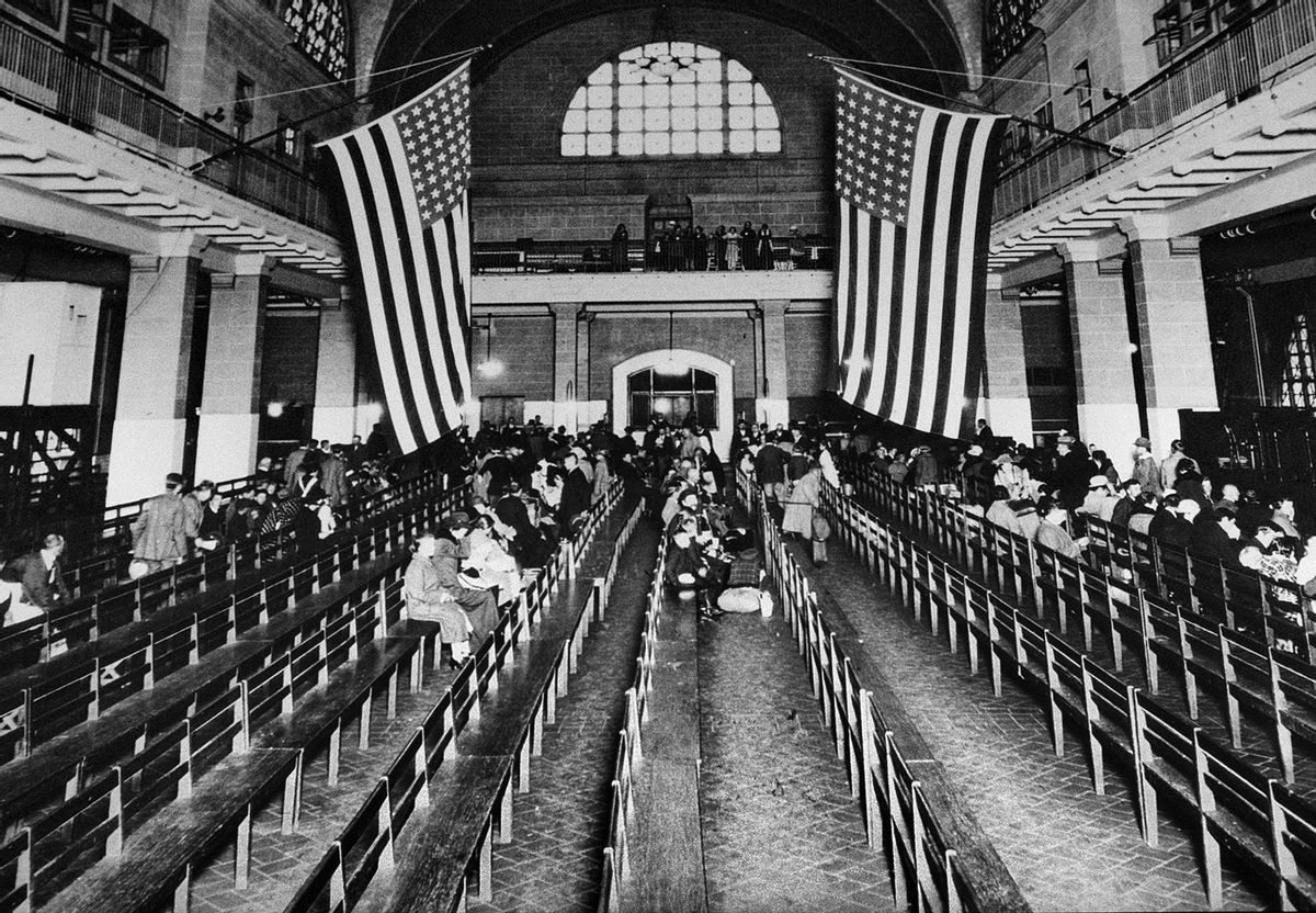 FILE - This 1924 file photo shows the registry room at Ellis Island in New York harbor, a gateway to America for millions of immigrants. The American self-image is forever intertwined with the melting pot _ a nation that embraces the world’s wretched refuse, a nation built by immigrants. But America’s immigration history is complicated. () (AP Photo/File)