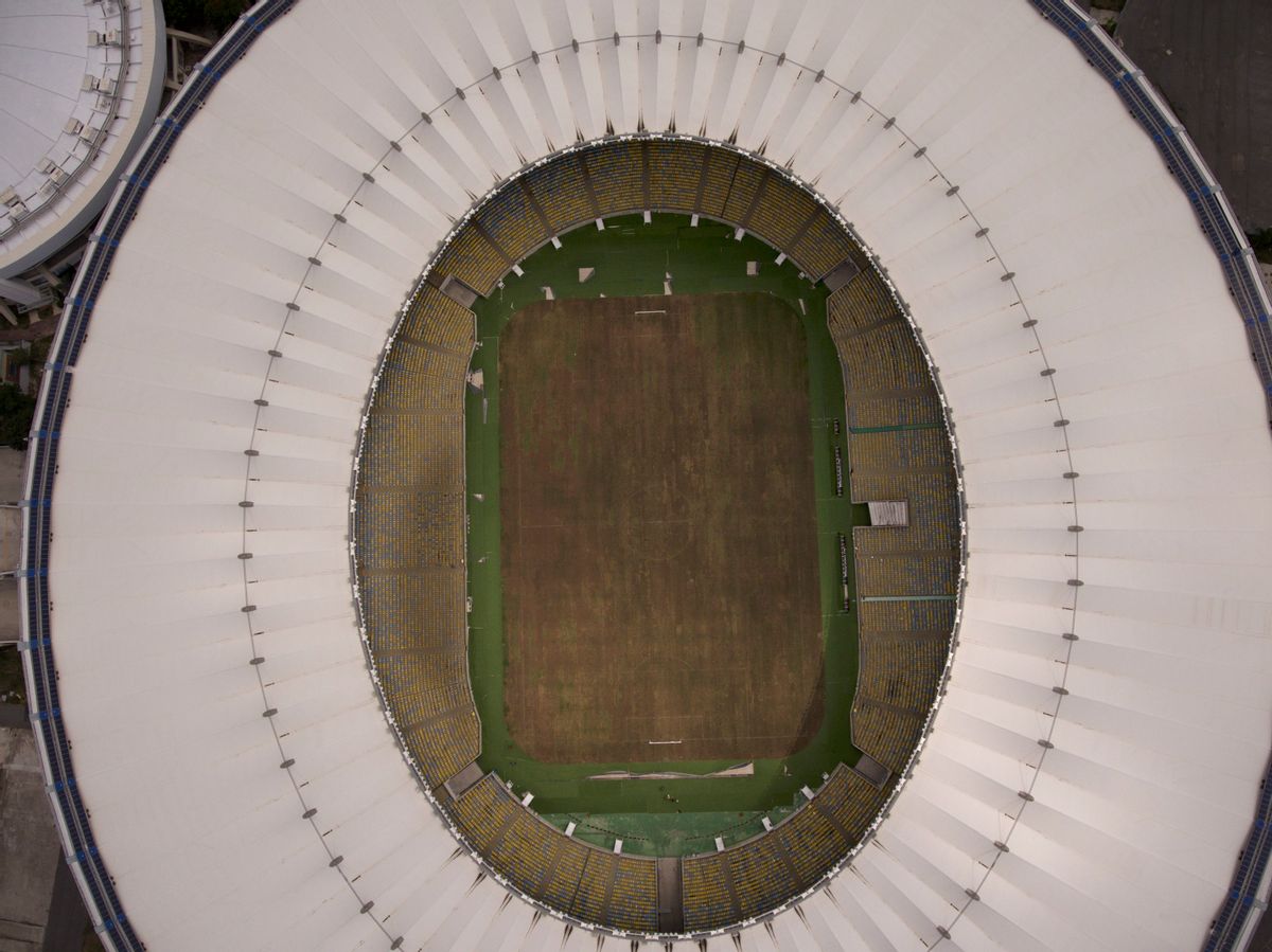 This Feb. 2, 2017 photo shows Maracana stadium's dry playing field in Rio de Janeiro, Brazil. The stadium was renovated for the 2014 World Cup at a cost of about $500 million, and largely abandoned after the Olympics and Paralympics, then hit by vandals who ripped out thousands of seats and stole televisions. (AP Photo/Mario Lobao) (AP)
