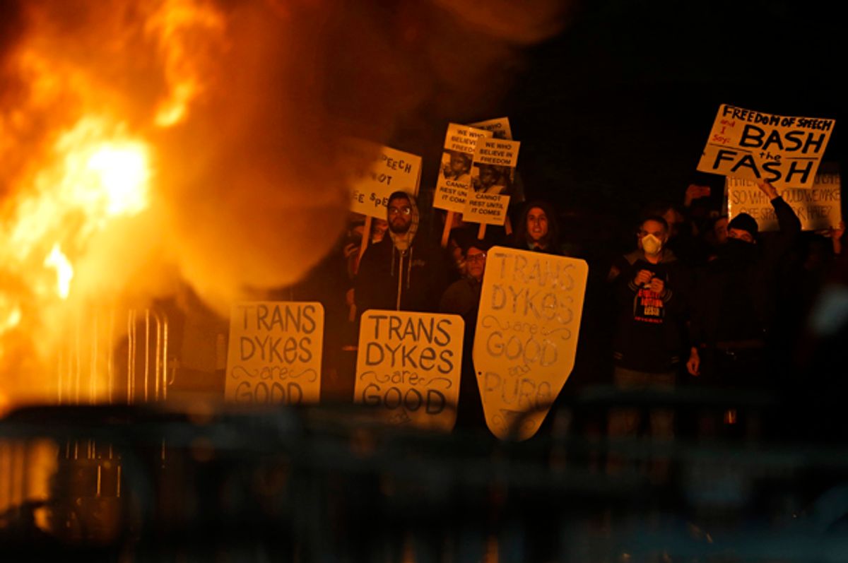 Protestors watch a fire on Sproul Plaza during a rally against the scheduled speaking appearance by Breitbart News editor Milo Yiannopoulos on the University of California at Berkeley campus on Wednesday, Feb. 1, 2017   (AP/Ben Margot)