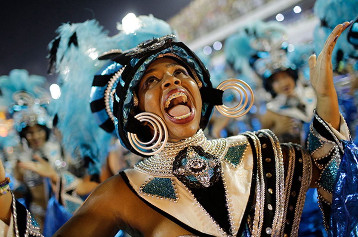 A performer from the Vila Isabel samba school parades during Carnival celebrations at the Sambadrome in Rio de Janeiro, Brazil, Monday, Feb. 27, 2017. (AP Photo/Silvia Izquierdo) (AP)