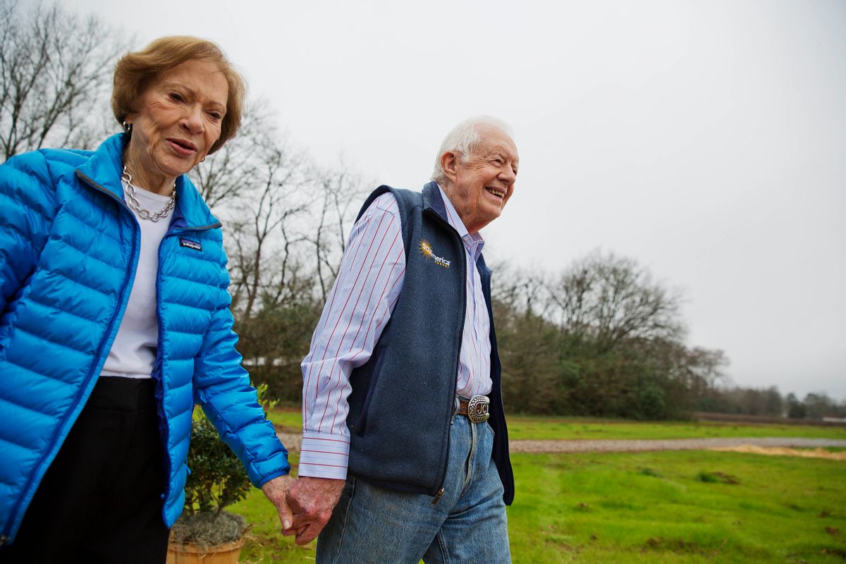 Former President Jimmy Carter, right, and his wife Rosalynn arrive for a ribbon cutting ceremony for a solar panel project on farmland he owns in their hometown of Plains, Ga., Wednesday, Feb. 8, 2017. Carter leased the land to Atlanta-based SolAmerica Energy, which owns, operates, and sells power generated from solar cells. The company estimates the project will provide more than half of the power needed in this town of 755 people. (AP Photo/David Goldman) (AP)