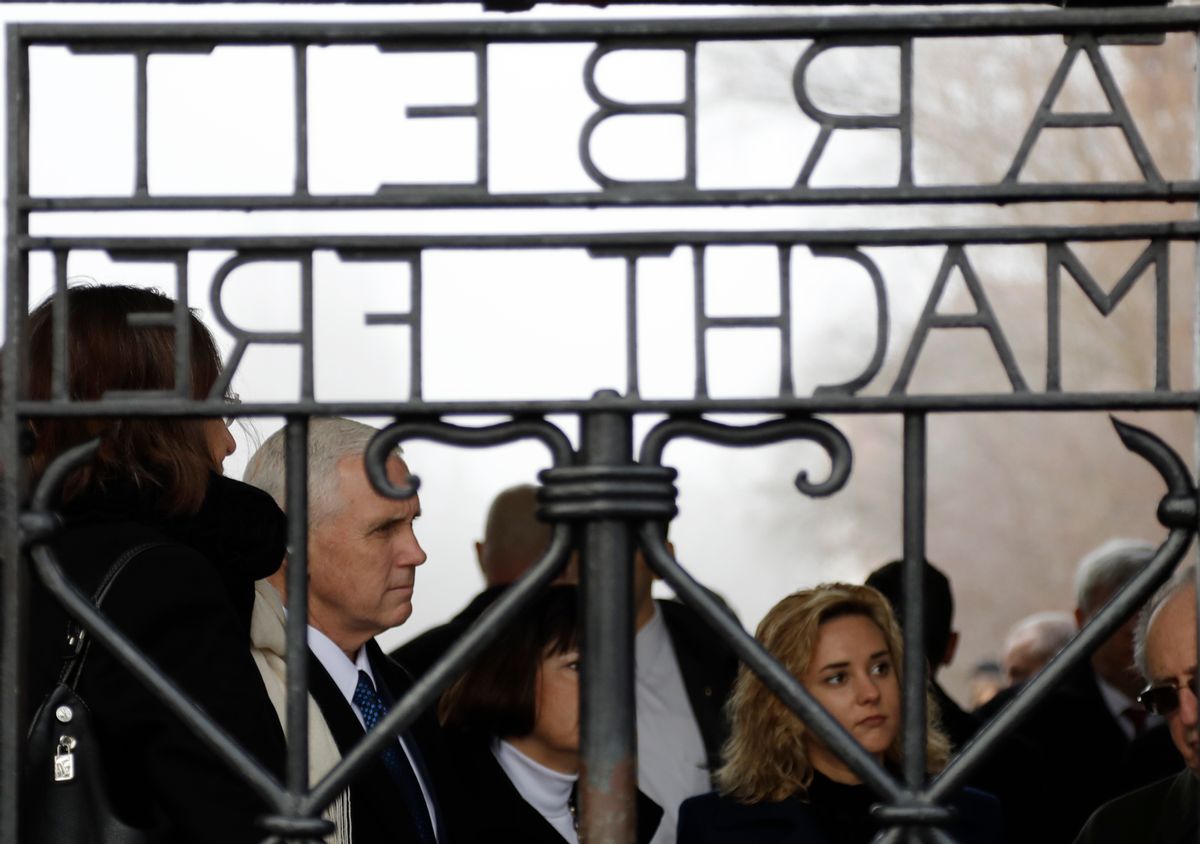 U.S. Vice President Mike Pence, his wife Karen and his daughter Charlotte, from left, stand behind the gate with the infamous writing "Work sets you free" as they visit the former Nazi concentration camp in Dachau near Munich, southern Germany, Sunday, Feb. 19, 2017, one day after he attended the Munich Security Conference. (AP Photo/Matthias Schrader) (AP)