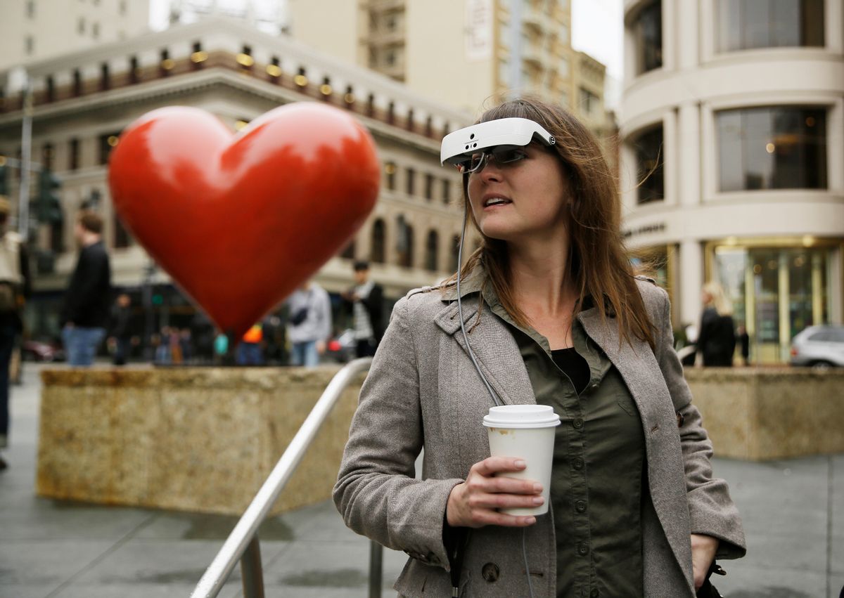 In this photo taken Thursday, Feb. 2, 2017, Yvonne Felix wears eSight electronic glasses and looks around Union Square during a visit to San Francisco. The glasses enable the legally blind to see. Felix was diagnosed with Stargardt's disease after being hit by a car at the age of seven. (AP Photo/Eric Risberg) (AP)