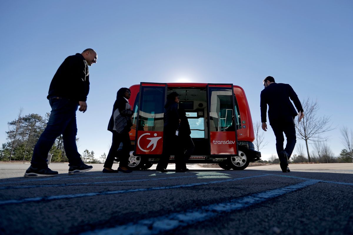 In this Thursday, Jan. 26, 2017 photo, a driverless shuttle sits on display at the Riverside EpiCenter in Austell, Ga. Self-driving vehicles could begin tooling down a bustling Atlanta street full of cars, buses, bicyclists and college students, as the city vies with other communities nationwide to test the emerging technology. (AP Photo/David Goldman) (AP Photo/David Goldman)