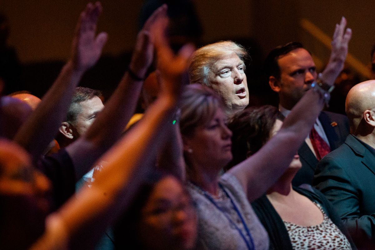 FILE- In this Oct. 30, 2016, file photo, Republican presidential candidate Donald Trump stands during a service at the International Church of Las Vegas in Las Vegas. President Trump’s pledge to scrap limits on church political activity could have sweeping effects that extend beyond his conservative supporters to more liberal congregations, including the black evangelical church that has long helped anchor the Democratic Party’s electoral machinery. (AP Photo/Evan Vucci, File) (AP)