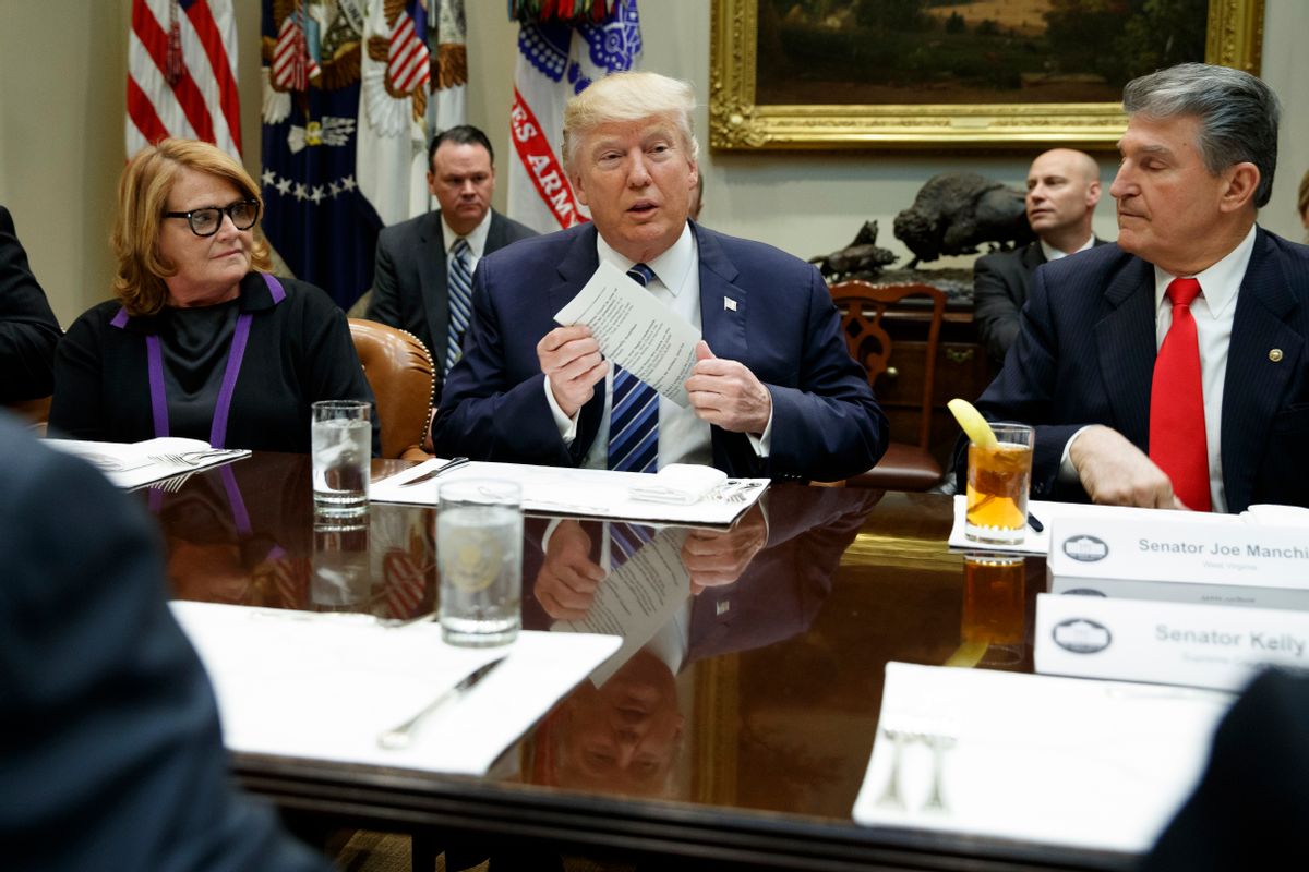 President Donald Trump, flanked by Sen. Heidi Heitkamp, D-N.D., left, and Sen. Joe Manchin, D-W.Va., speaks during a meeting with Senators on his Supreme Court Justice nominee Neil Gorsuch, Thursday, Feb. 9, 2017, in the Roosevelt Room of the White House in Washington. (AP Photo/Evan Vucci) (AP)