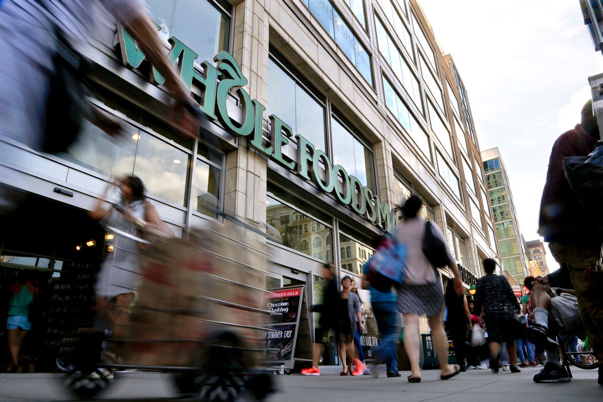 FILE - In this Wednesday, June 24, 2015, file photo, pedestrians pass in front of a Whole Foods Market store in Union Square in New York. Whole Foods said Wednesday, Feb. 8, 2017, that sales fell 2.4 percent at established locations, marking the sixth straight quarter of declines as it faces competitive pressures. (AP Photo/Julie Jacobson, File) (AP)