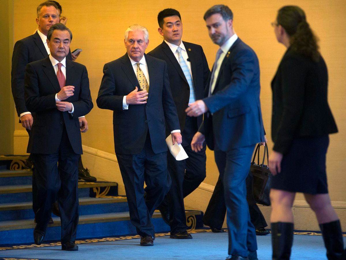 U.S. Secretary of State Rex Tillerson, second left, and Chinese Foreign Minister Wang Yi, left, Beijing, China (AP Photo/Mark Schiefelbein, Pool)