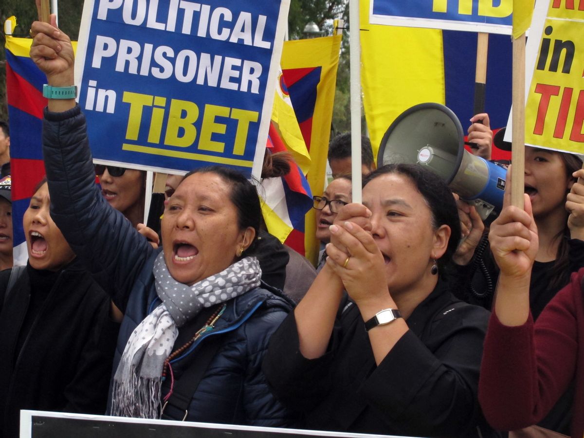 Free Tibet protesters demonstrate outside Australia's Parliament House on Thursday, March 23, 2017, in Canberra, Australia, ahead of the arrival of Chinese Premier Li Keqiang. Li arrived in Canberra on Wednesday on a mission to expand bilateral ties as U.S. President Donald Trump proposes an "America First" overhaul of global trade. (AP Photo/Rod McGuirk) (AP)
