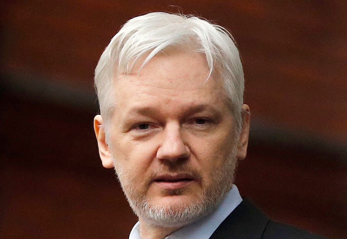 FILE - In this Feb. 5, 2016, file photo, WikiLeaks founder Julian Assange stands on the balcony of the Ecuadorean Embassy in London. Assange said in a video release Thursday march 9, 2017 that his group will work with technology companies to help defeat the Central Intelligence Agency's hacking tools. Assange says "we have decided to work with them, to give them some exclusive access to some of the technical details we have, so that fixes can be pushed out."﻿ () (AP Photo/Frank Augstein, File)