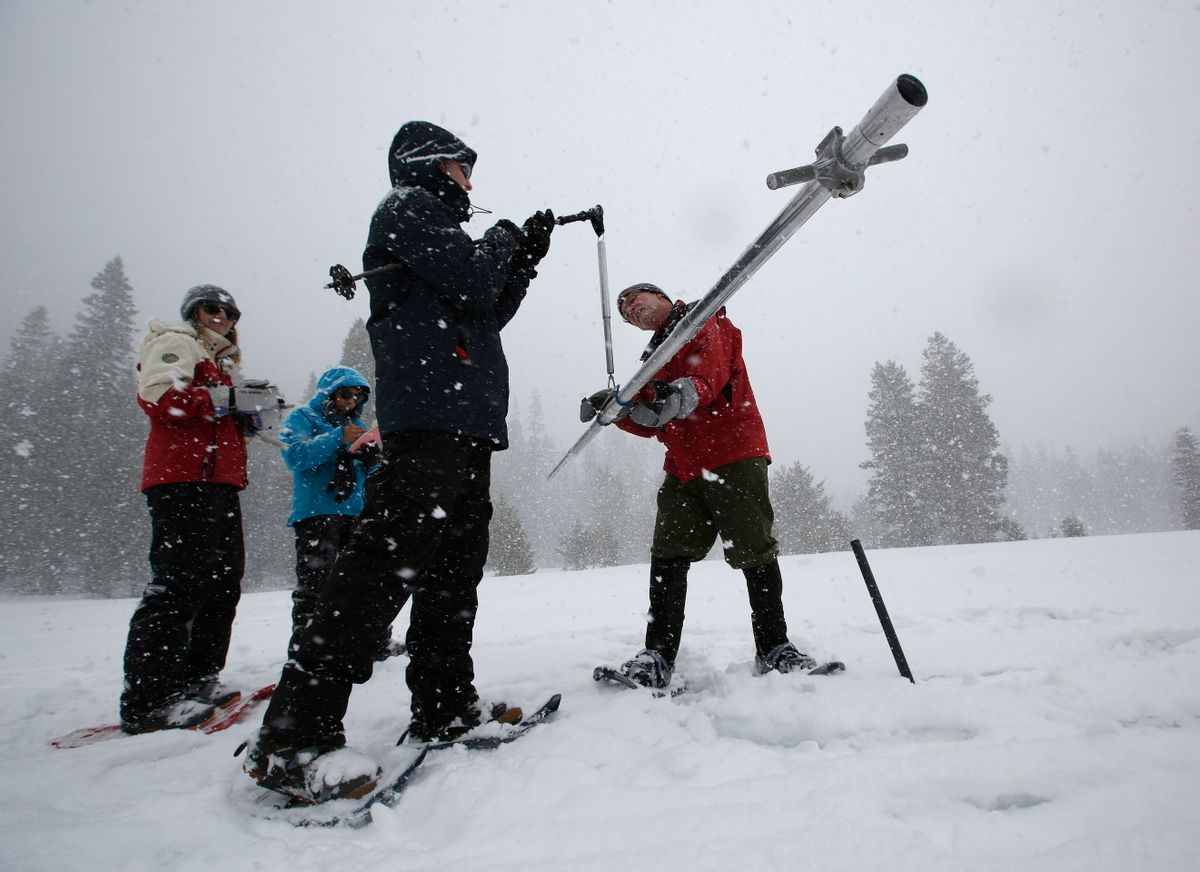 Frank Gehrke, right, chief of the California Cooperative Snow Surveys Program for the Department of Water Resources, places the snow survey tube on a scale held by Nic Enstice, of the Sierra Nevada Conservancy while doing the manual snow survey at Phillips Station, Thursday, March 30, 2017, near Echo Summit, Calif.  (AP Photo/Rich Pedroncelli) (AP)