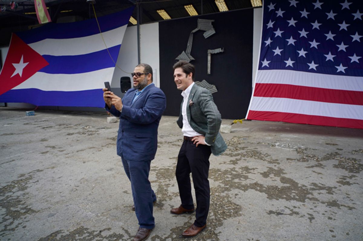 Google's head of Cuba operations, Brett Perlmutter, and Alexis Leiva Machado, a Cuban sculptor, take a selfie at the entrance of a new Google technology center in Havana, Cuba, March 21, 2016.   (AP/Ramon Espinosa)