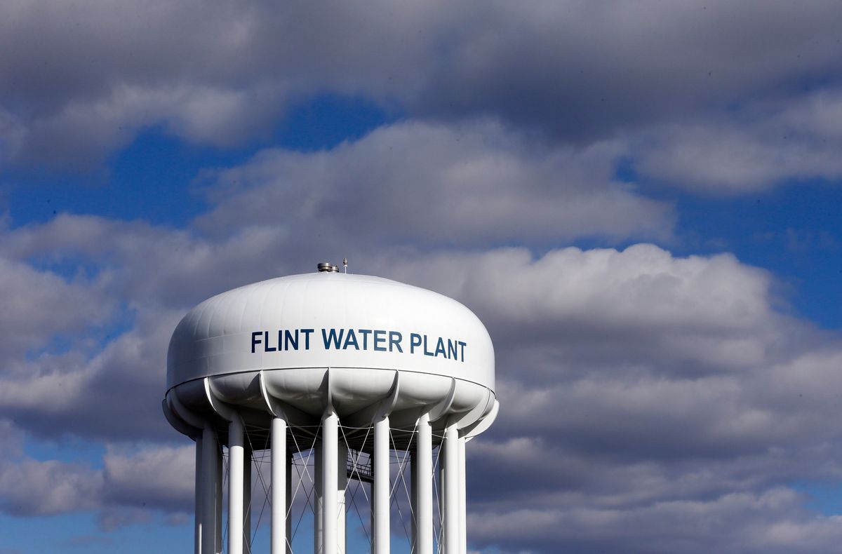 FILE - In this March 21, 2016 file photo, the Flint Water Plant water tower is seen in Flint, Mich. The Trump administration would slash programs aimed at slowing climate change and improving water safety and air quality, while eliminating thousands of jobs, according to a draft of the Environmental Protection Agency budget proposal obtained by the Associated Press.  (AP Photo/Carlos Osorio, File) (AP)