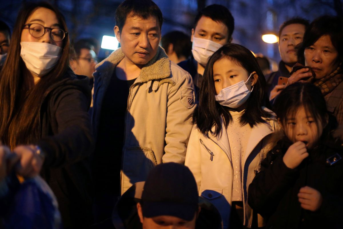 Chinese immigrants gather to protest over the fatal shooting of a Chinese man in his apartment, in Paris, Tuesday, March 28, 2017. Chinese immigrants and China's government are protesting a police killing in Paris that prompted violent street clashes and exposed the fears and frustrations of France's large Asian community. (AP Photo/Thibault Camus) (AP)