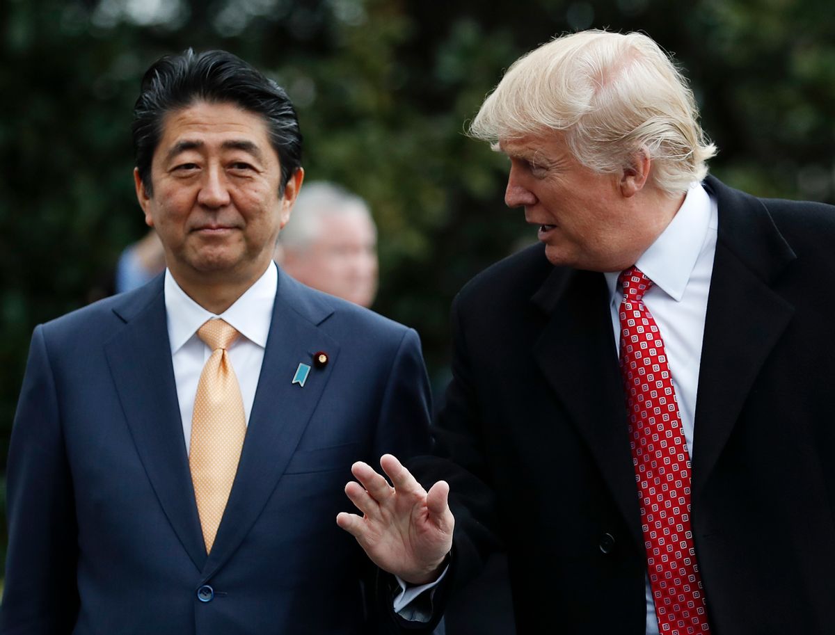 FILE - In this Feb. 10, 2017, file photo, U.S. President Donald Trump talks to Japanese Prime Minister Shinzo Abe, left, as they pause before boarding Marine One on the South Lawn of the White House in Washington, for the short trip to Andrews Air Force Base en route to West Palm Beach, Fla.  Japan’s ruling party is expected to approve a change in party rules Sunday, March 5, 2017, that could pave the way for Abe to become the country’s longest-serving leader in the post-World War II era. (AP Photo/Carolyn Kaster, File) (AP)