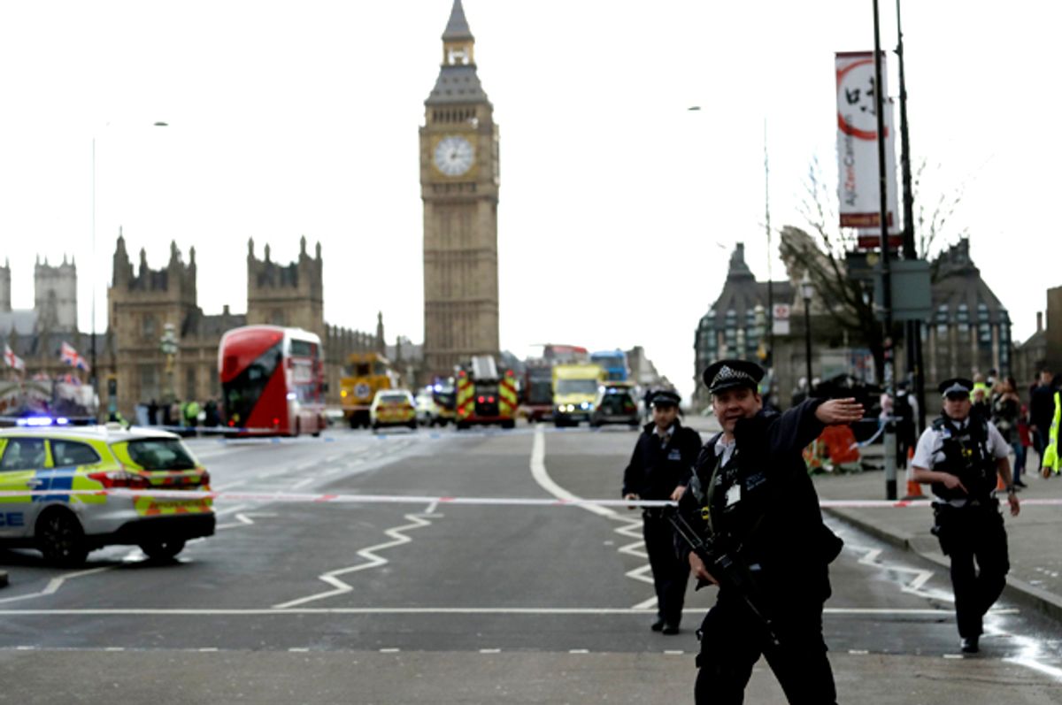 Police secure the area on the south side of Westminster Bridge close to the Houses of Parliament in London   (AP/Matt Dunham)