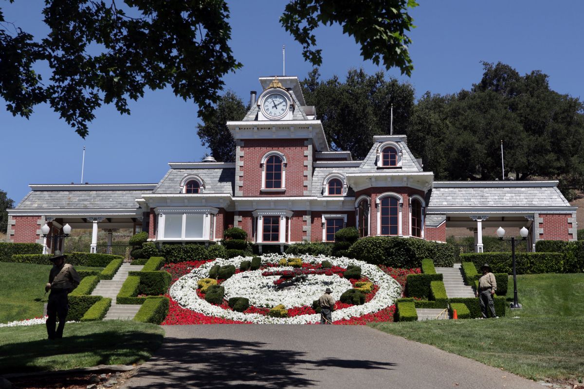 FILE - In this July 2, 2009, file photo, workers standby at the train station at Neverland Ranch in Los Olivos, Calif. Michael Jackson's former home has been renamed Sycamore Valley Ranch. The Los Angeles Times reported March 1, 2017, that it had been relisted for sale for $67 million. (AP Photo/Carolyn Kaster, File) (AP)
