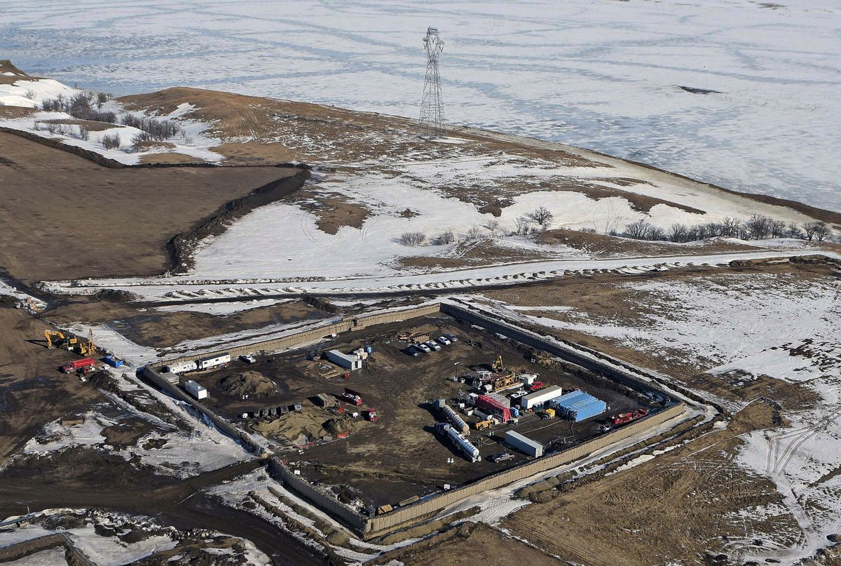FILE - In this Feb. 13, 2017, aerial file photo shows the site where the final phase of the Dakota Access Pipeline will take place with boring equipment routing the pipeline underground and across Lake Oahe to connect with the existing pipeline in Emmons County near Cannon Ball, N.D. American Indians from across the country are bringing their frustrations with the Trump administration and its approval of the Dakota Access oil pipeline to the nation's capital Tuesday, March 7, 2017, kicking off four days of activities that will culminate in a march on the White House. (e) (Tom Stromme/The Bismarck Tribune via AP, File)