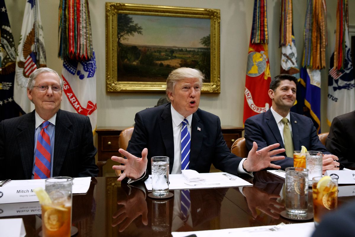 President Donald Trump, flanked by Senate Majority Leader Mitch McConnell of Ky., left, and House Speaker Paul Ryan of Wis., speaks during a meeting with House and Senate leadership, Wednesday, March 1, 2017, in the Roosevelt Room of the White House in Washington. () (AP Photo/Evan Vucci)