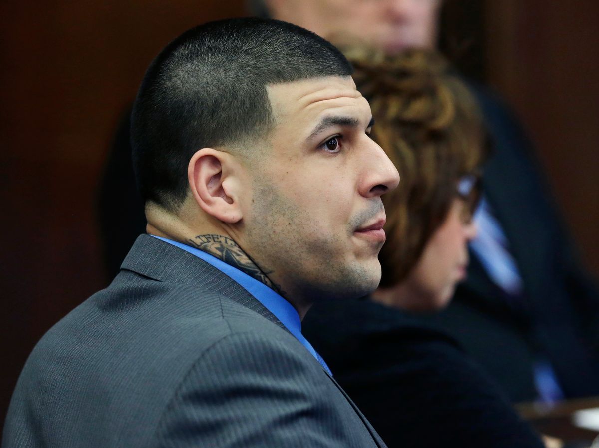 Defendant Aaron Hernandez listens as Judge Jeffrey Locke addresses the jury's question during his double murder trial at Suffolk Superior Court, Tuesday, April 11, 2017, in Boston. Hernandez is on trial for the July 2012 killings of Daniel de Abreu and Safiro Furtado who he encountered in a Boston nightclub. The former New England Patriots NFL player is already serving a life sentence in the 2013 killing of semi-professional football player Odin Lloyd. (AP Photo/Elise Amendola, Pool) (AP)