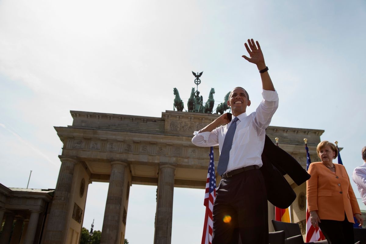 FILE - In this June 19, 2013 file photo President Barack Obama, accompanied by German Chancellor Angela Merkel, waves to the crowd after speaking at the Brandenburg Gate in Berlin. Obama will return to Berlin to attend an event of the Lutheran Church conference end of May 2017.  (AP Photo/Evan Vucci, file) (AP)