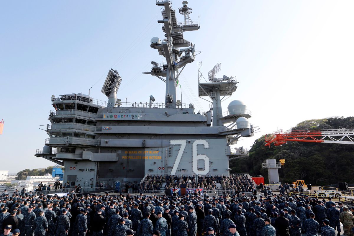 U.S. servicemen and Japanese Self-Defense Forces personnel wait for the arrival of U.S. Vice President Mike Pence on the flight deck of U.S. navy nuclear-powered aircraft carrier USS Ronald Reagan, at the U.S. Navy's Yokosuka base in Yokosuka, south of Tokyo, Wednesday, April 19, 2017. (AP Photo/Eugene Hoshiko) (AP)