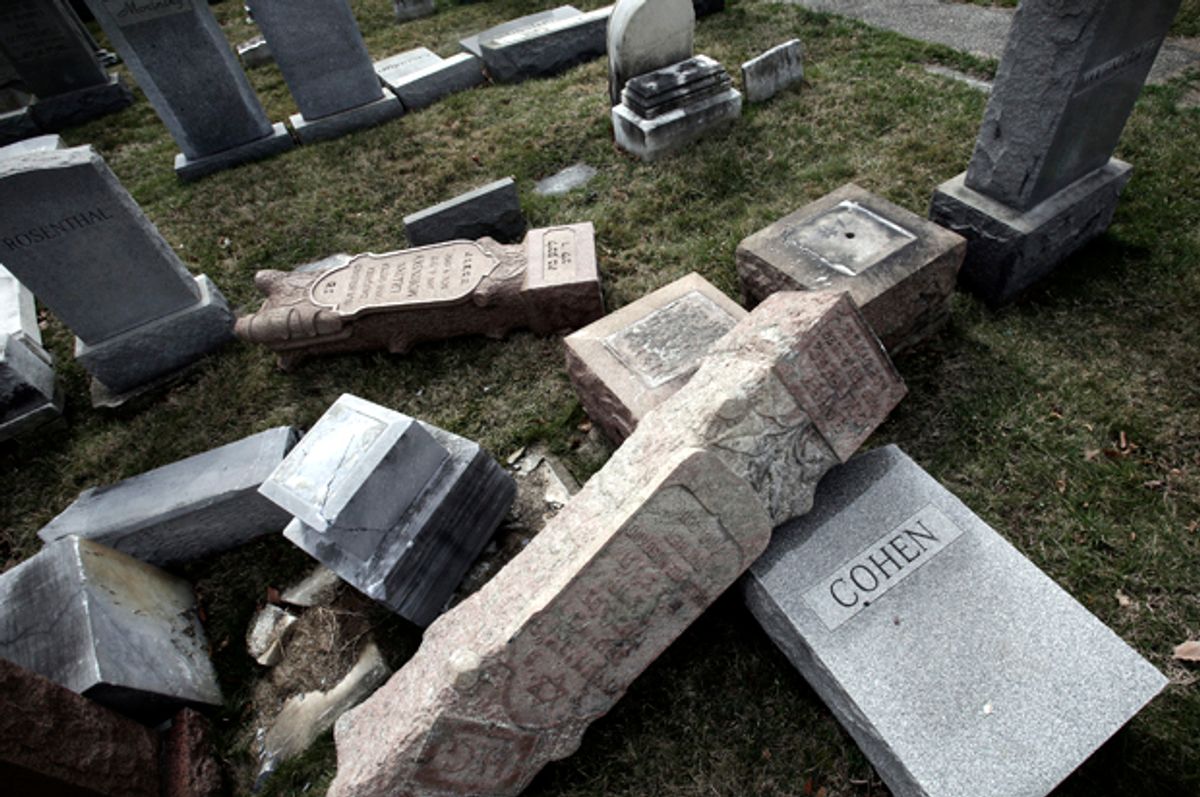Damaged headstones in Jewish cemetery   (AP Photo/Jacqueline Larma)