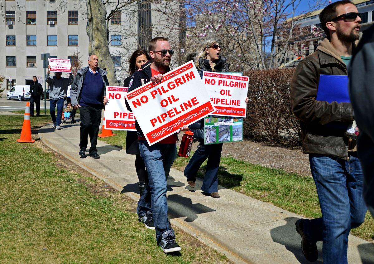 FILE - In this March 29, 2016, file photo, activists and residents from across Bergen County deliver petitions against the proposed Pilgrim Pipeline project in New York and New Jersey In Hackensack, N.J. Prolonged protests in North Dakota failed to stop the flow of oil through the Dakota Access pipeline. But they've provided inspiration for protests against pipelines around the country. Tactics used in North Dakota such as resistance camps, social media and online fundraising are now being used against pipeline projects in nearly a dozen states. (Amy Newman/The Record of Bergen County via AP, File) (AP)