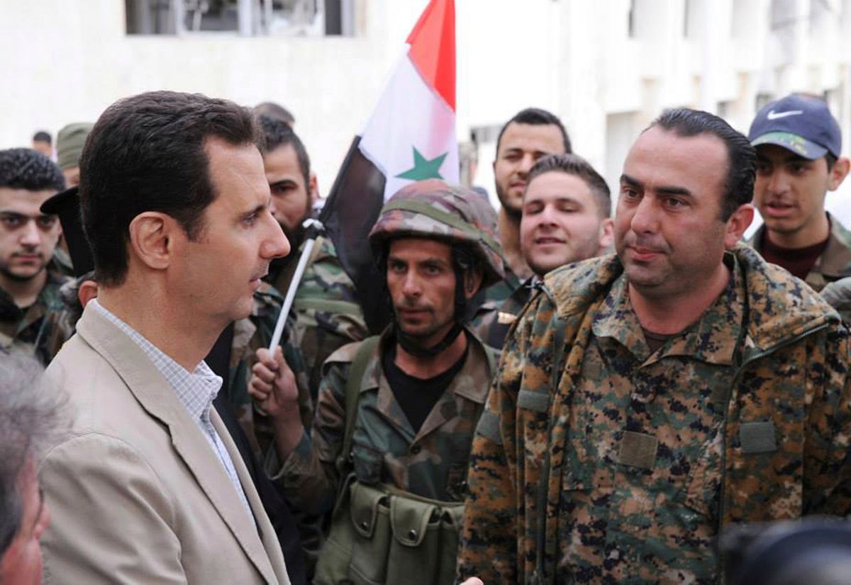 FILE - In this April 20, 2014 file photo, released by the Syrian official news agency SANA, Syrian President Bashar Assad, left, talks to government soldiers during his visit to the Christian village of Maaloula, near Damascus, Syria. U.S. Secretary of State Rex Tillerson’s statement Tuesday, April 11, 2017, that the reign of President Bashar Assad’s family “is coming to an end” suggests Washington is taking a much more aggressive approach about the Syrian leader. Taking him out of the equation without a clear transition plan would be a major gamble. (SANA via AP, File) (AP)