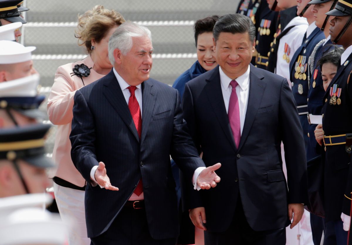 In this April 6, 2017, photo, Secretary of State Rex Tillerson, left, walks with Chinese president Xi Jinping at the Palm Beach International Airport in West Palm Beach, Fla.  (AP Photo/Lynne Sladky)