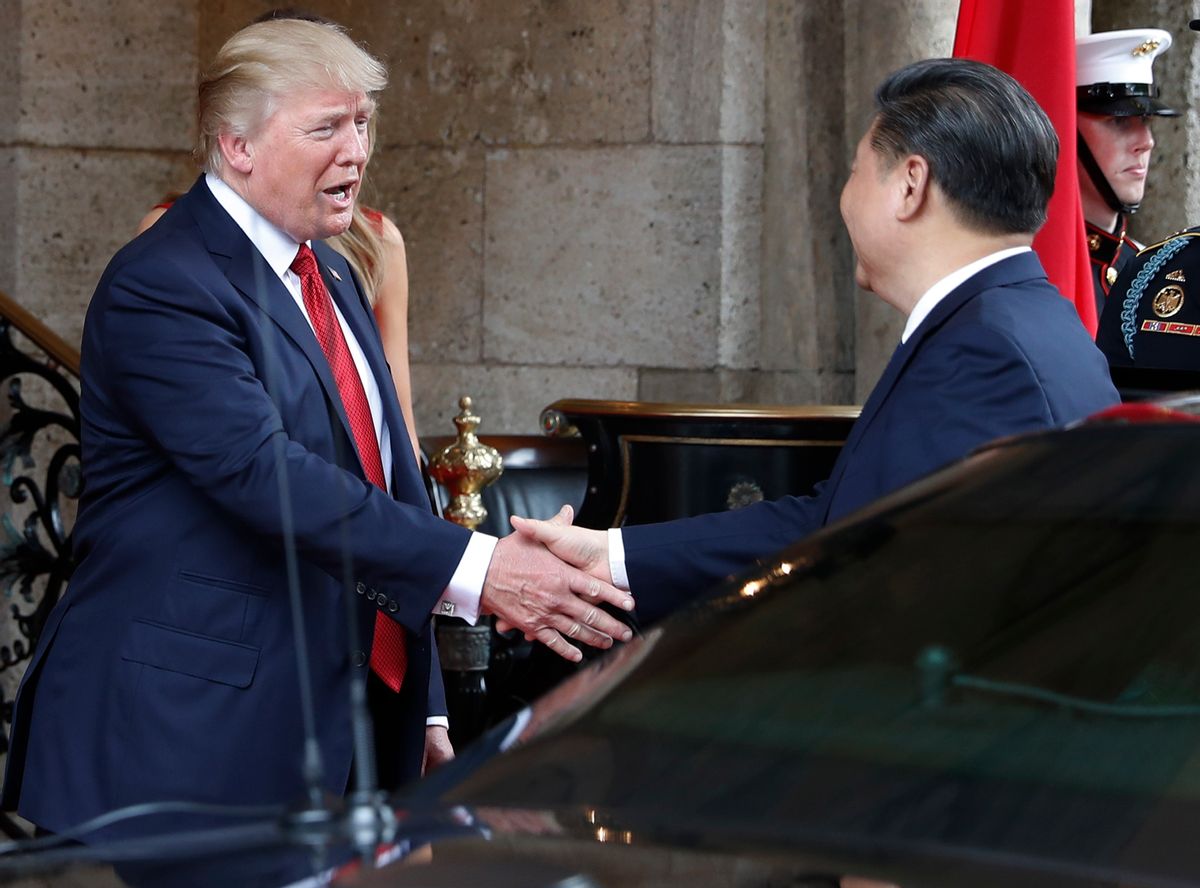 FILE - In this Thursday, April 6, 2017, file photo, President Donald Trump shakes hands with Chinese President Xi Jinping as he arrives before dinner at Mar-a-Lago resort, in Palm Beach, Fla. In recent weeks, Trump has moved away from his tough campaign rhetoric on trade. Trump's threat to slap harsh tariffs on Chinese goods has given way to a bid to mend fences with Beijing. (AP Photo/Alex Brandon, File) (AP)