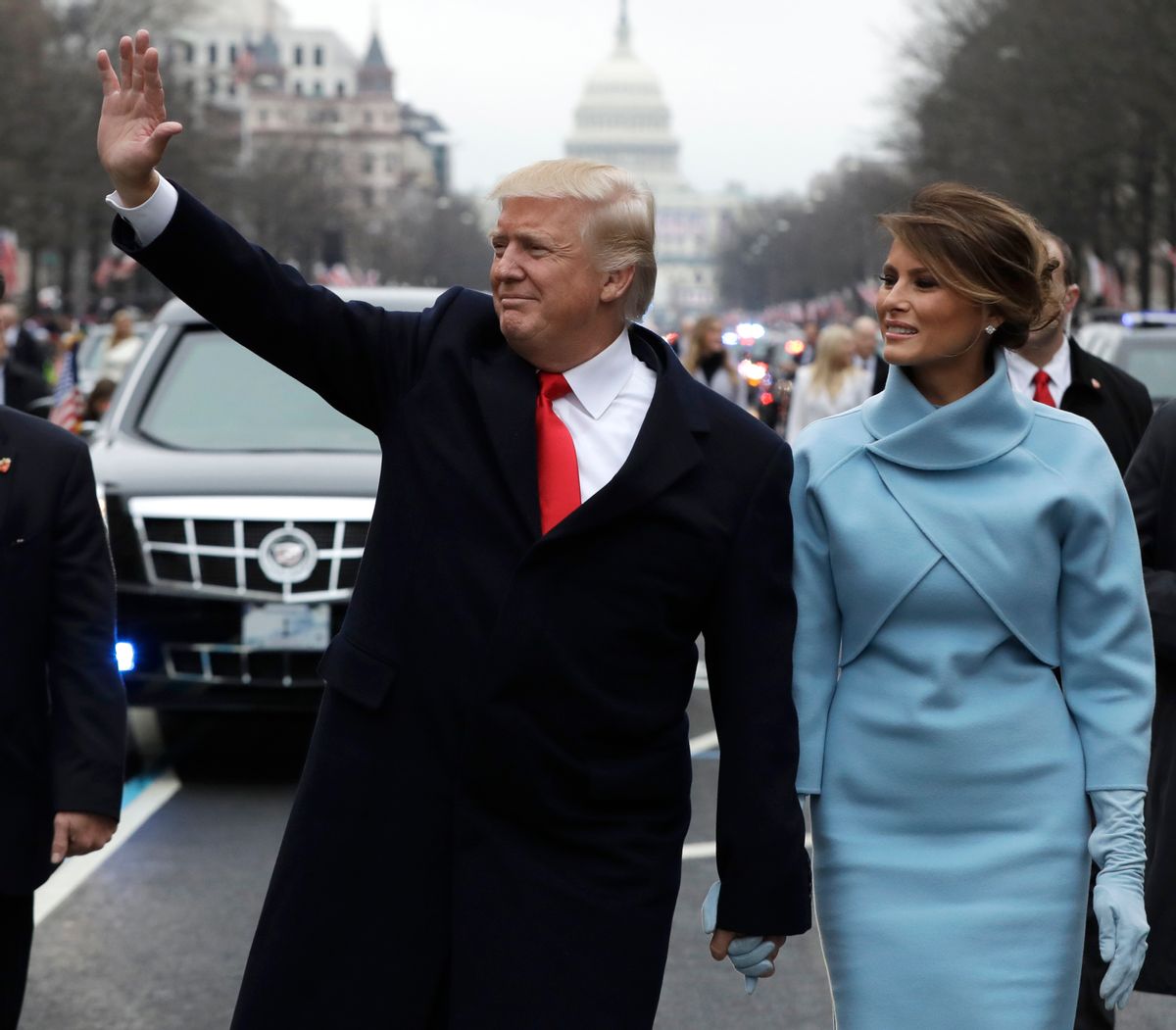 FILE- In this Jan. 20, 2017, file photo, President Donald Trump waves as he walks with first lady Melania Trump during the inauguration parade on Pennsylvania Avenue in Washington. Trump raised $107 million for his inaugural festivities. Trump’s inaugural committee is due to file information about those donors with the Federal Election Commission and said it would do so on Tuesday, April 18. (AP Photo/Evan Vucci, Pool, File) (AP)
