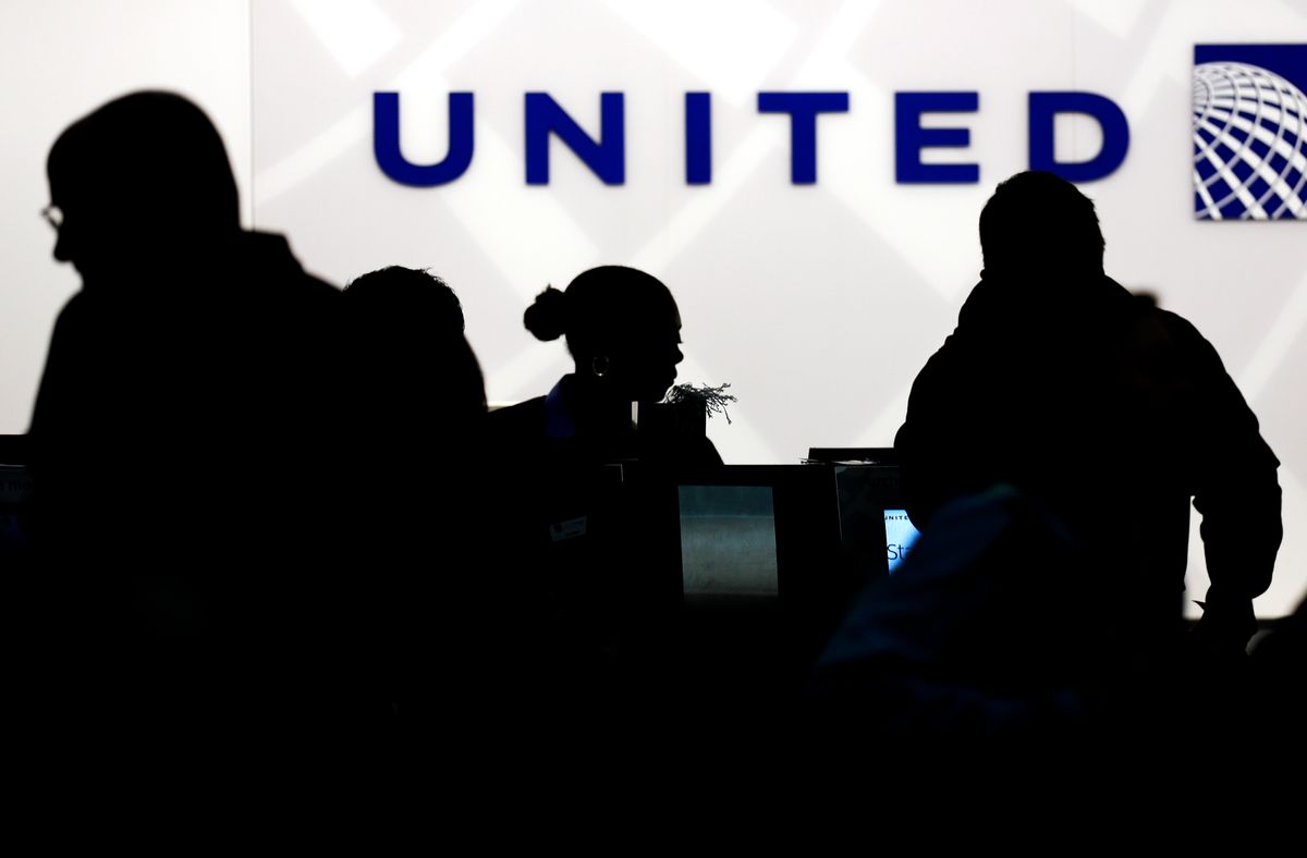 FILE - In this Saturday, Dec. 21, 2013, file photo, travelers check in at the United Airlines ticket counter at Terminal 1 in O'Hare International Airport in Chicago. After a man is dragged off a United Express flight on Sunday, April 9, 2017, United Airlines becomes the butt of jokes online and on late-night TV. Travel and public-relations experts say United has fumbled the situation from the start, but it’s impossible to know if the damage is temporary or lasting. Air travelers are drawn to the cheapest price no matter the name on the plane. (AP Photo/Nam Y. Huh, File) (AP)
