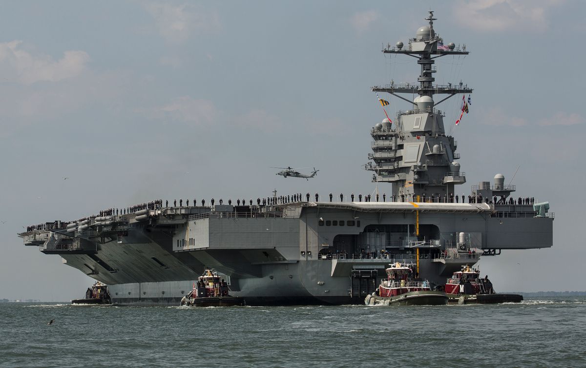 As crew members stand on the deck, the aircraft carrier USS Gerald R. Ford heads to the Norfolk, Va., naval station on Friday, April 14, 2017 after almost a week of builder's trials during which the ships systems were tested. (Bill Tiernan/The Virginian-Pilot via AP) (AP)