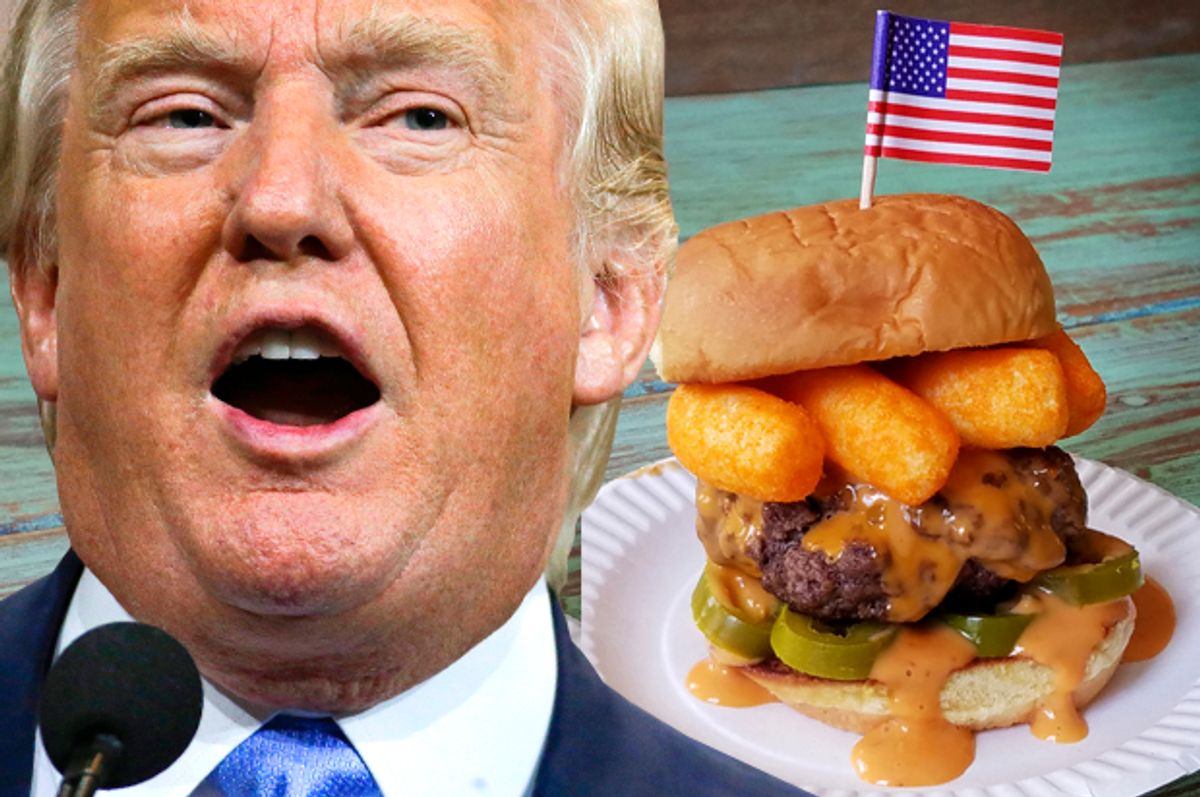 Donald Trump next to his namesake burger.   (AP/Mark Humphrey/George Motz)
