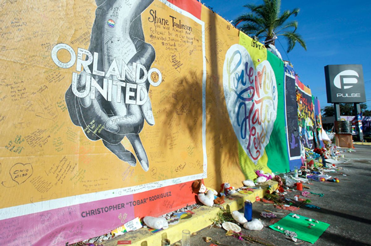 Artwork and signatures cover a fence around the Pulse nightclub (AP/John Raoux)