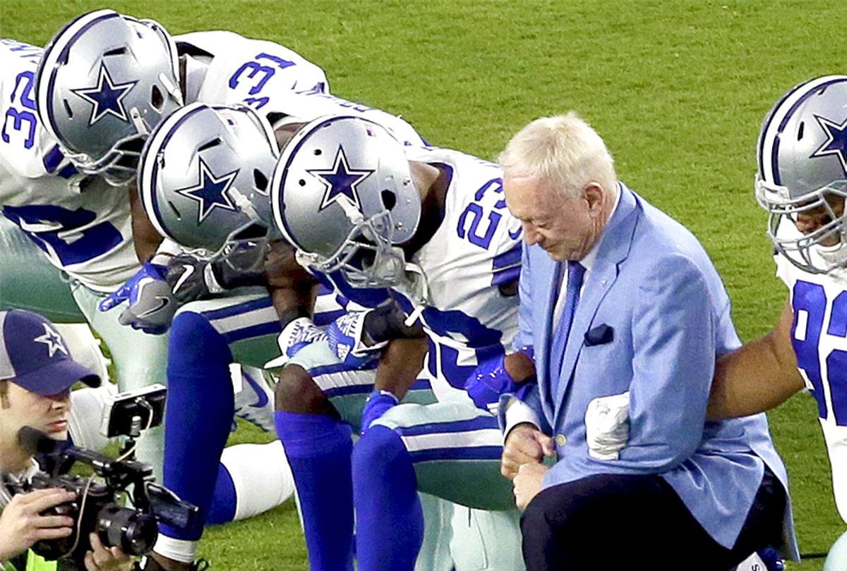 The Dallas Cowboys and owner Jerry Jones take a knee prior to the national anthem, Monday, Sept. 25, 2017 (AP/Matt York)
